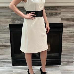 Winter white dress quite versatile to accessorize.